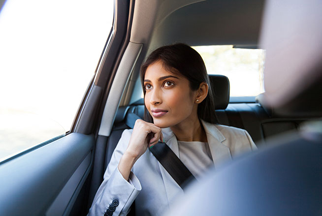 Female In Car Looking Out Window